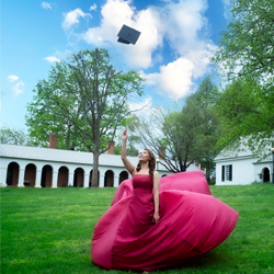 Tanya Blaine SCPS Student throwing graduation cap in air