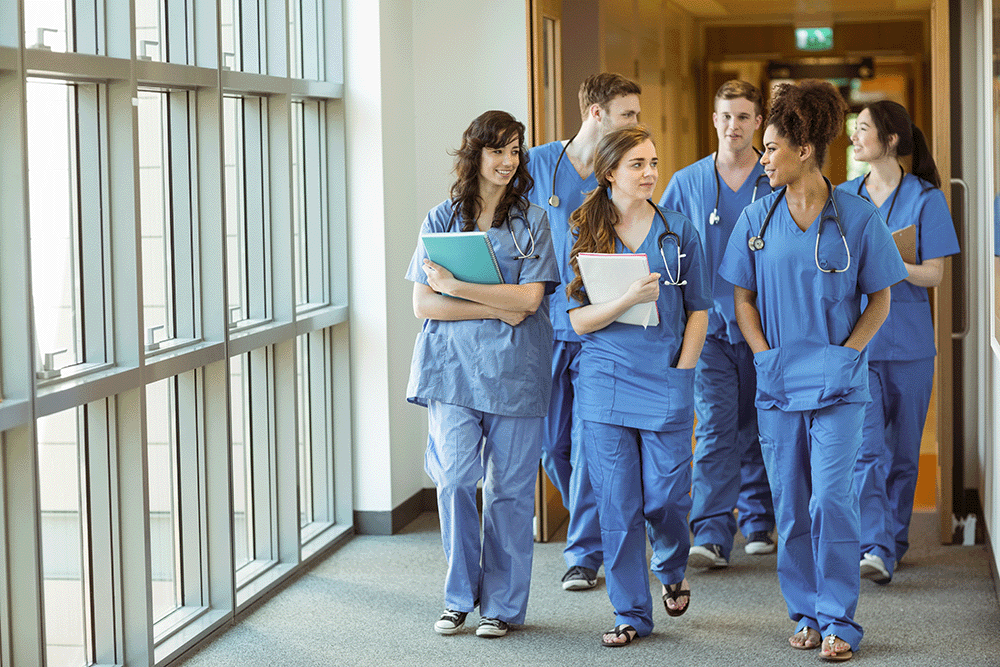 Medical Students walk together in hallway