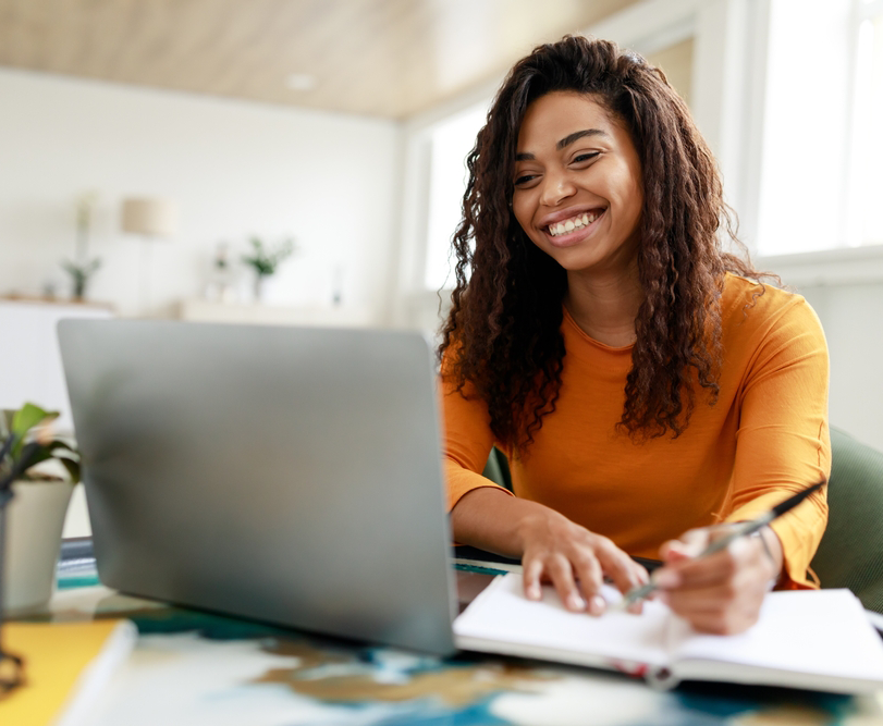 woman smiles while working online