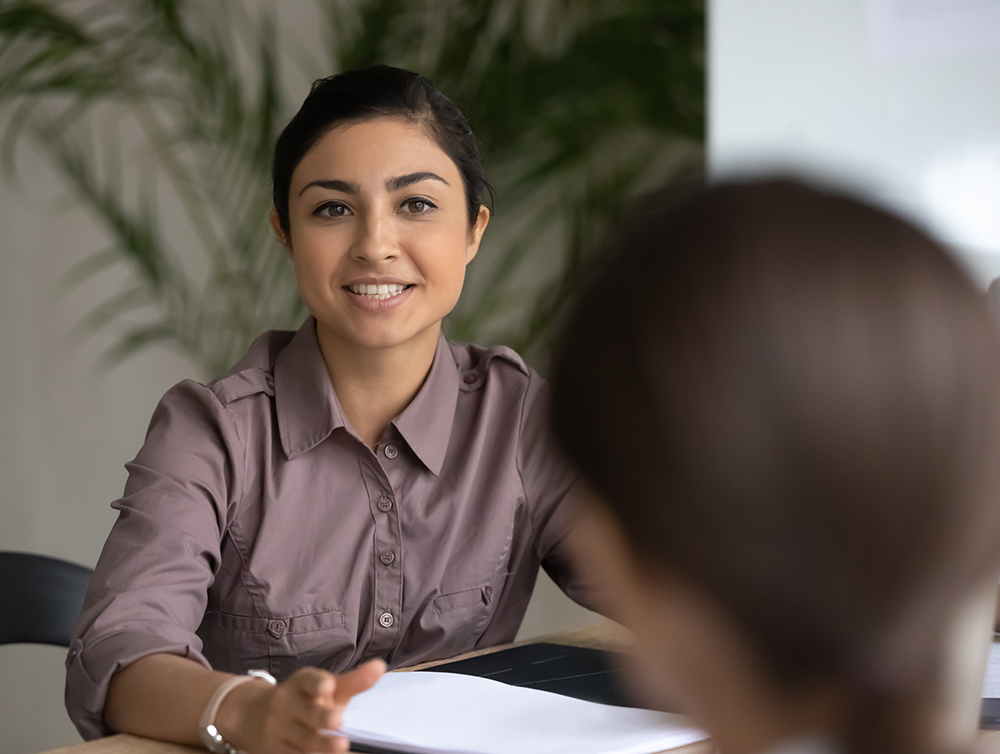 young female professional coaches another female