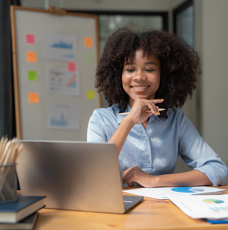 Woman on computer smiling