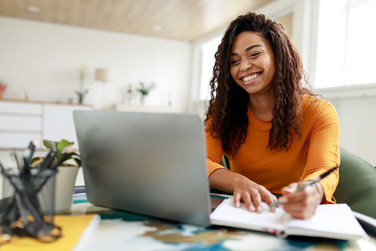 Smiling Woman on Computer