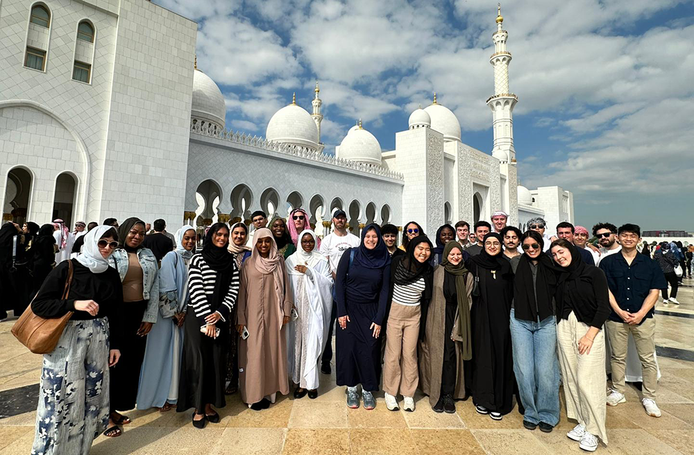 Study abroad students stand in front of a mosque in Dubai