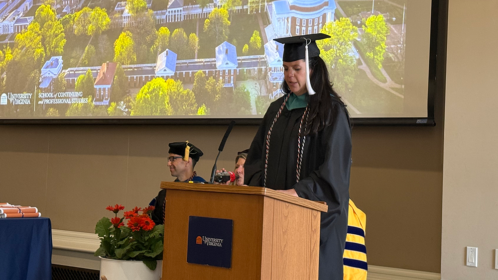 Keri Adcock addresses her fellow MPS graduates at UVA's Final Exercises.