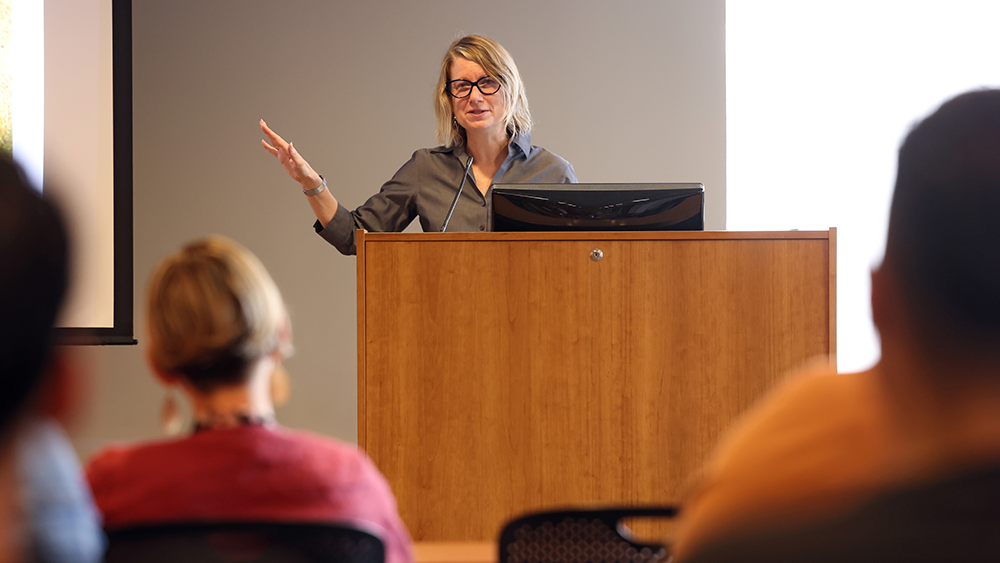 Sara McClellan teaches at a lecture.